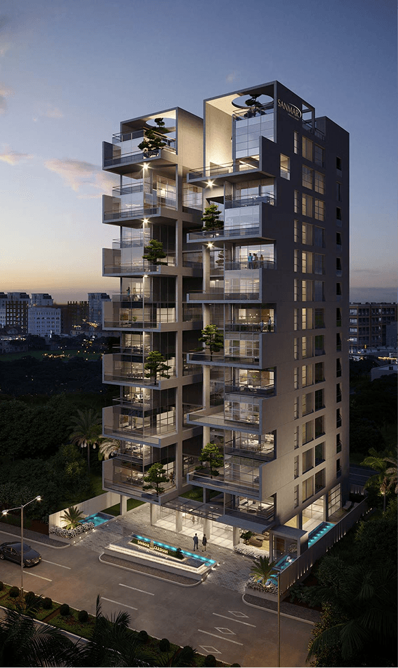 Modern white residential building surrounded by trees